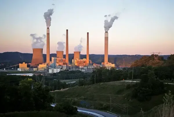 Emissions and steam rise from an American Electric Power coal-fired power plant in Winfield, West Virginia, in 2018.