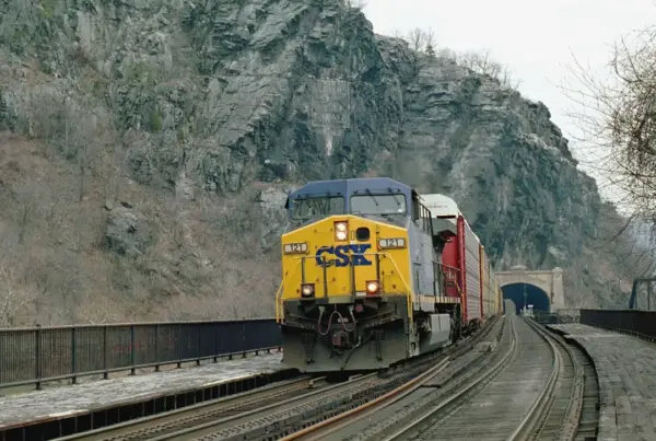 A CSX freight train passes over the Potomac River from Maryland into West Virginia. The company has joined others in stating it will report its climate lobbying.